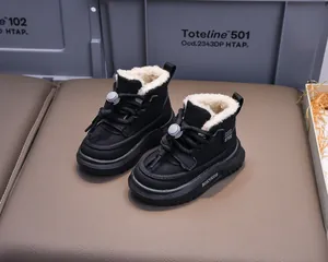 Detailed close-up of kids winter snow boots with warm faux wool lining and non-slip sole