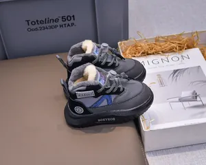 Detail view of children's winter snow boots featuring thick fleece lining and non-slip soles