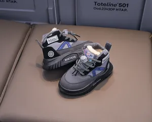 Detailed view of kids winter snow boots with thick faux lamb wool lining and blue accents