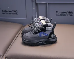 Macro detail of thick faux fur lining inside children's winter boots with durable grey mesh