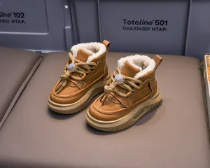 Close-up of winter toddler snow boots with warm faux fur lining and non-slip soles