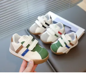 Detail of colorful kids' velcro sneakers with suede panels and durable rubber soles