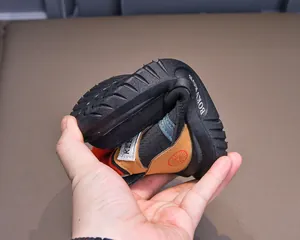 Flexible sole close-up of durable winter kids snow boots showing high flexibility