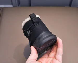 Detail of warm winter boots featuring thick faux fleece lining and a durable non-slip rubber sole