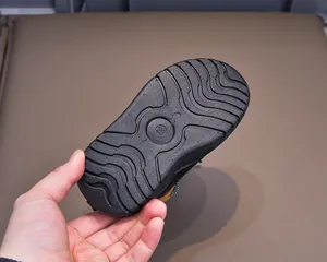 Detail of the anti-slip black wavy sole with size 23 marking for kids snow boots