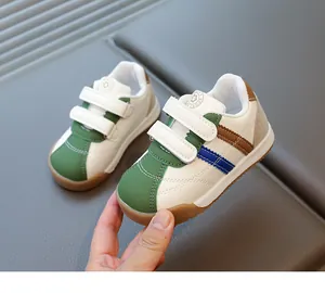 Detail of kids sport sneakers with velcro straps and durable retro rubber soles