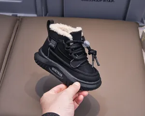 Detail of waterproof kids winter boot featuring thick fleece lining and drawstring toggle