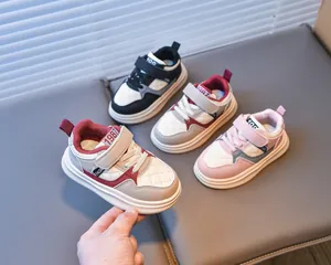 Detail of kids casual sneakers with velcro straps and diamond quilted stitching patterns