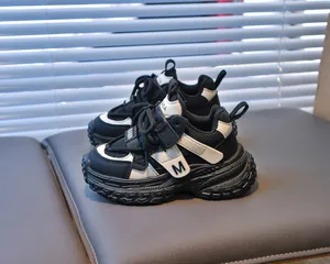 Detail of girls sneakers with breathable mesh, velcro strap, and thick rubber sole