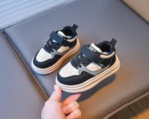 Detail of waterproof kids sneakers with velcro straps and anti-slip rubber soles