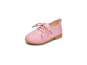 Close-up of pink leather girls shoes with detailed stitching and durable rubber soles