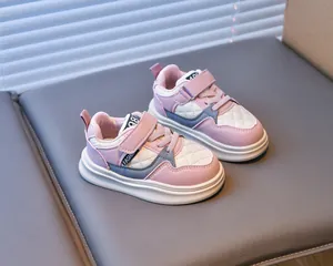 Detail view of pink children sneakers featuring quilted leather and velcro straps