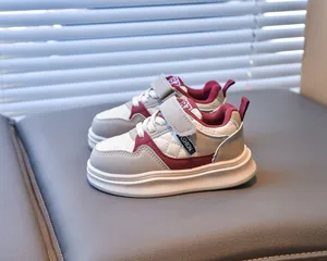 Detailed close-up of kids waterproof sneakers featuring 1987 logo and leather texture