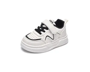 Close-up of kids leather sneaker featuring velcro closure and spade pattern on sole