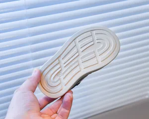Detailed view of durable non-slip rubber sole for kids sneakers with size 23 mark