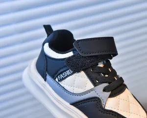 Close-up of children sneakers with quilted leather, velcro straps and fashion label