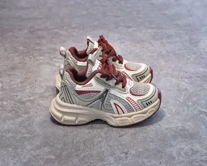 Detail view of children's breathable mesh sneakers featuring retro chunky sole design