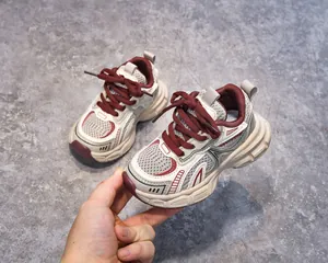 Close-up of children's retro chunky sneakers featuring breathable mesh and thick soles