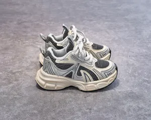 Detailed top view of kids' retro running shoes featuring breathable mesh and thick soles