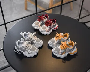 Detail view of breathable mesh fabrics and anti-slip thick soles on toddler sneakers
