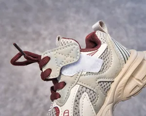Detailed close-up of kids retro sports shoe with breathable mesh and velcro strap