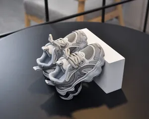 Detailed macro view of breathable mesh and wave-textured thick sole on girls sneakers