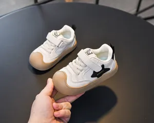 Detail view of toddler sneakers with anti-slip rubber sole and protective toe cap