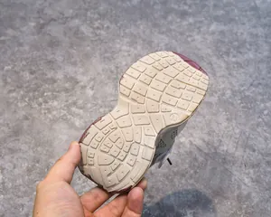 Detailed view of kids breathable mesh sneaker sole with anti-slip grip in size 23