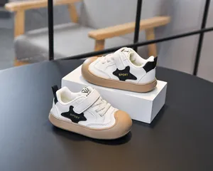 Detail of kids' sporty sneakers with star patch and hook-and-loop closure