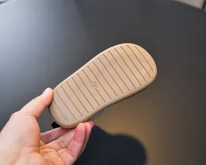 Detail view of anti-slip rubber outsole with size 23 marking for kids sneakers