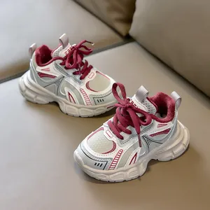 Detailed close-up of kids warm sneakers featuring burgundy fleece lining and mesh upper
