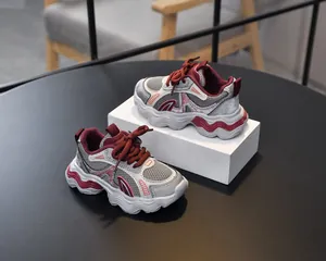 Detail of the breathable mesh upper and wavy anti-slip thick sole on kids sports sneakers