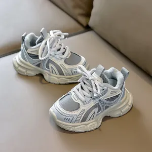 Detail of warm plush lining and non-slip thick sole on children's grey-blue sports sneakers