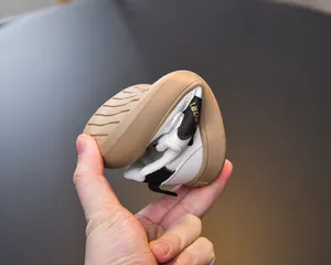 Macro shot of flexible rubber sole on children's sneakers showing high elasticity and grip