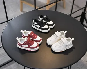 Top view of toddler sports shoes with hook-and-loop closure in three color variants