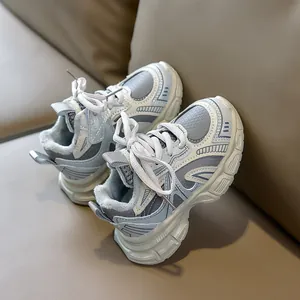 Detailed view of kids' winter sneakers with warm gray plush lining and mesh fabric