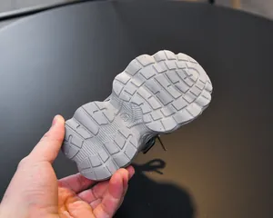 Detail view of anti-slip chunky rubber sole on girls sneakers with size 23 engraving