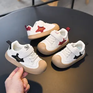 Children's white sneakers with velcro straps and anti-slip rubber toe caps in autumn style