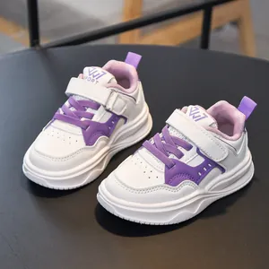 Kids lightweight running shoes with purple accents and velcro straps for daily sports