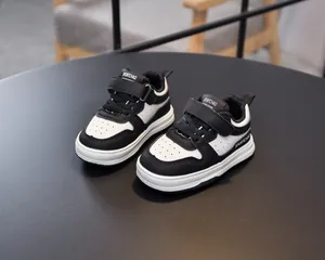 Detail of toddler sports shoes featuring breathable toe holes and hook-and-loop closure