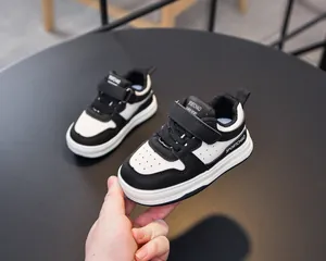 Detail of toddler sports sneakers with breathable toe holes and velcro strap