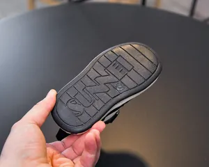 Detail of toddler sneaker sole with non-slip SUNNI pattern and size 23 engraving