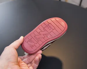 Detail of toddler non-slip rubber sole with texture and size 23 marker