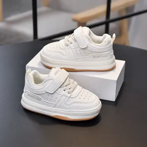 Classic white toddler sneakers with hook-and-loop closure and durable gum outsole