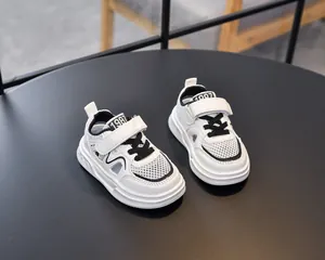 Top view of white kids sports sandals with 1987 print and breathable mesh fabric