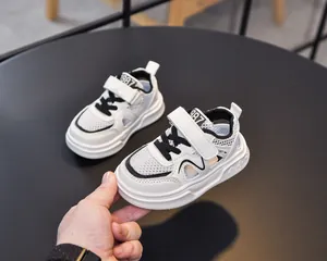 Detailed macro of breathable mesh and white leather stitching on children's sandals