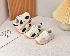 Detail view of breathable kids sneakers with hook-and-loop straps and non-slip rubber soles