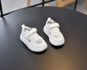Detail of white kids sports sandals with breathable mesh and Velcro strap closure