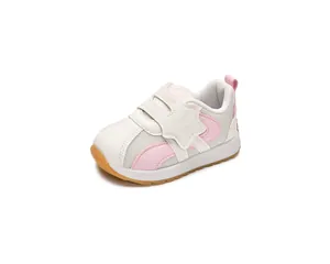 Detail of pink mesh toddler shoe with star decoration and convenient hook-and-loop closure