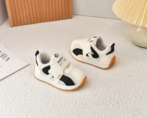 Macro shot of breathable mesh children sneakers with anti-slip orange rubber sole